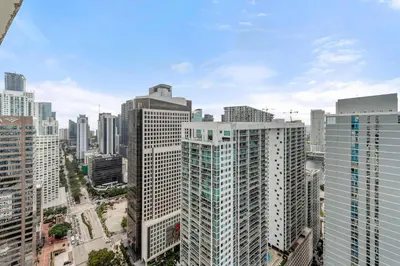 an aerial view of a city with tall buildings at Luxury Waterfront W Hotel Condo Brickell Skyline Views in Miami