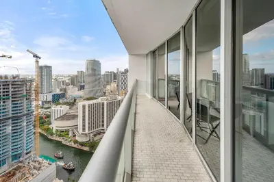 a balcony with a view of a city at Luxury Waterfront W Hotel Condo Brickell Skyline Views in Miami