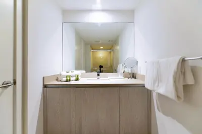 a bathroom with a sink and a mirror at Luxury Condo with Beach Access in Hollywood