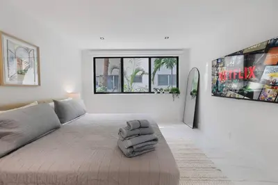 a white living room with a large bed in it at 2BR near Bal Harbour beautiful in Miami Beach