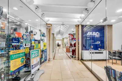 a store aisle with glass doors in a store at Beachfront Resort Studio with 2 Queen beds, Balcony & Pool in Sunny Isles Beach