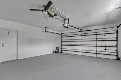 a room with white walls and a ceiling fan at Large corner Villa with Pool Table and Private Pool in Hollywood