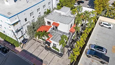 an overhead view of a house with palm trees at Retro Miami RareFREE Parking 1 Min to Beach in Miami Beach