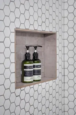 two bottles of disinfectants on a shelf in a bathroom at Steps from Ocean Art Deco 1BR & Free Parking in Miami Beach