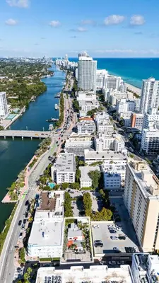 an aerial view of a city with a river and buildings at Steps from Ocean Art Deco 1BR & Free Parking in Miami Beach