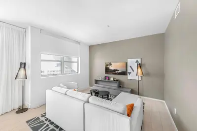 a living room with a white couch and a table at Hyde Dream Penthouse in Hollywood