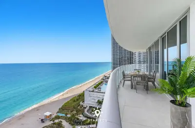 a balcony with a view of the beach and the ocean at Oceanline 3BR Corner Balcony & Calm Seas in Hollywood