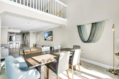 a dining room with a table and chairs at Beachfront Apartment in Miami Beach at the Casablanca Hotel in Miami Beach
