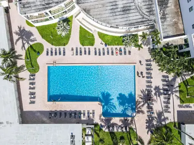 an overhead view of a pool at a resort at Beachfront Apartment in Miami Beach at the Casablanca Hotel in Miami Beach
