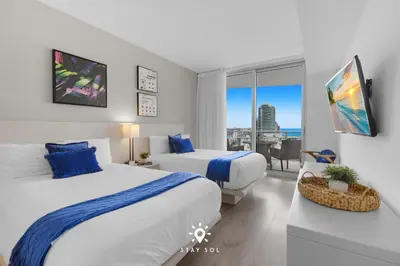 two beds in a hotel room with a view at Insane Ocean View Balcony - Beachfront Resort & Pool in Hollywood