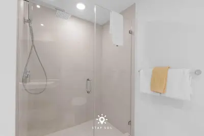 a shower with a glass door in a bathroom at Insane Ocean View Balcony - Beachfront Resort & Pool in Hollywood