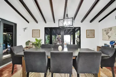 a dining room with a table and chairs at Spanish 5 Bedroom Pool House Minutes to the Beach in Hollywood