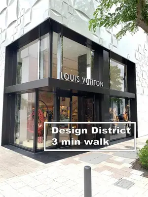 a design district min walk sign in front of a building at B10 7 MIN FROM MIAMI BEACH, 1 Bed Apartment, Design District & Wynwood in Miami