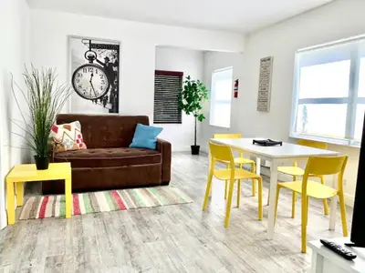 a living room with a couch and a table at B10 7 MIN FROM MIAMI BEACH, 1 Bed Apartment, Design District & Wynwood in Miami