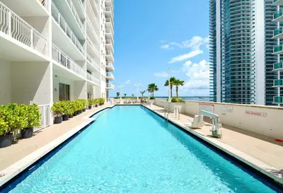 a swimming pool in the middle of a building at Stylish Condo with Panoramic Ocean Views in Miami
