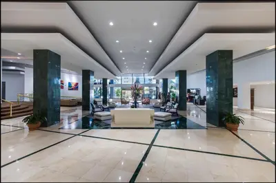 a lobby with couches and chairs in a building at Ocean Front Resort Studio in Miami Beach