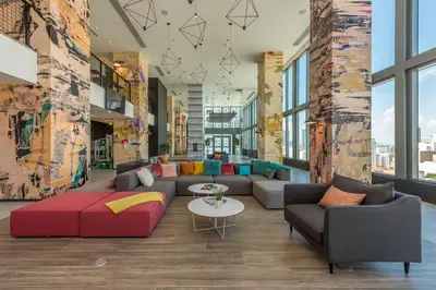 a lobby with couches and a table and windows at Amazing property in Miami