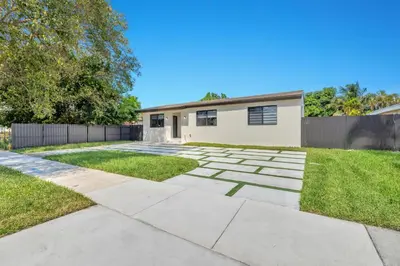 a driveway with a house in the background at NEW house in Miami Casa Calle 19 in Miami