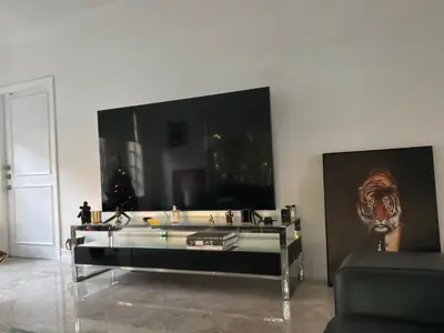 a living room with a glass table in a room at Private House Beach in Miami Beach