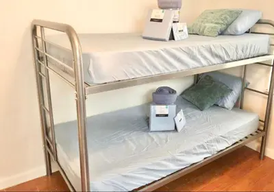 a couple of bunk beds in a room at Men Only Hostel Fort Lauderdale Airport Long Term OK in Fort Lauderdale
