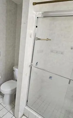 a bathroom with a glass shower with a toilet at Men Only Hostel Fort Lauderdale Airport Long Term OK in Fort Lauderdale