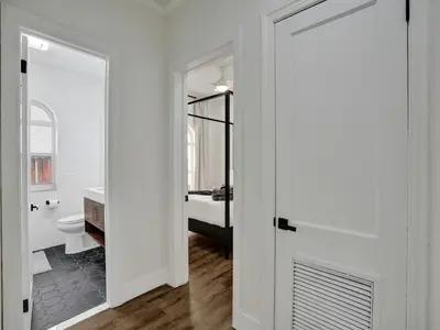 a white bathroom with a toilet and a sink at Classic 5 Bedroom 4 Bathroom Pool Home in Hollywood