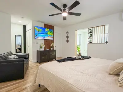 a bedroom with a bed and a ceiling fan at King Comfort Suite Kitchen Wi-Fi Parking in Pembroke Pines