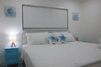 a bedroom with a bed with two blue stars on it at 20 OFF BLUE WAVE 10min Beach and Airport in Fort Lauderdale