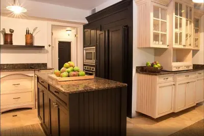 a kitchen with a bowl of apples on a counter at Historic Sailboat Bend Home 5 Min to Las Olas 4 miles to the Beach in Fort Lauderdale