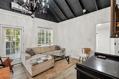 a living room with a couch and a table at Newly Renovated Home- Sailboat Bend - Walk to Las Olas - 4 Miles to Beach in Fort Lauderdale