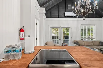 a kitchen with a wooden counter top in a room at Newly Renovated Home- Sailboat Bend - Walk to Las Olas - 4 Miles to Beach in Fort Lauderdale