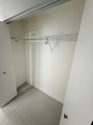 an empty room with a shelf on the wall at Stylish Urban 5350 Park Doral in Miami
