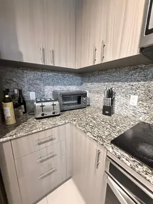 a kitchen with a counter top with a toaster oven at Stylish Urban 5350 Park Doral in Miami