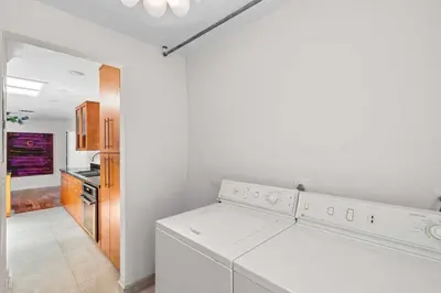 a white laundry room with a washer and dryer at Brazilian Style Getaway 2 Minutes to Beach in Hollywood