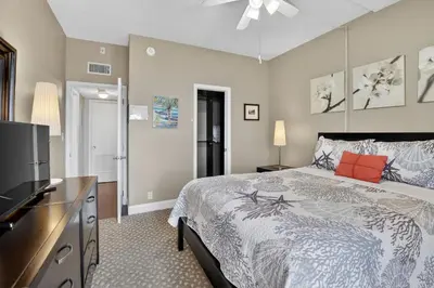 a bedroom with a bed and a flat screen tv at Beach Haven Condo for 2 in Fort Lauderdale