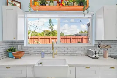 a kitchen counter with a sink and a window at Private Retreat with Yard Near Hard Rock Stadium in Miramar