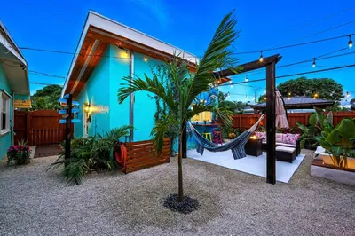 a house with a hammock in front of it at Private Retreat with Yard Near Hard Rock Stadium in Miramar