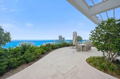 an outdoor patio with a view of the ocean at NOK Amazing 1 BR in Miami Beach in Miami Beach