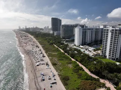 an aerial view of a beach with buildings and the ocean at South Beach Luxury 2 Bedroom Condo on the Ocean in Miami Beach