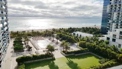 an aerial view of a resort with the beach at South Beach Amazing Ocean View in Miami Beach