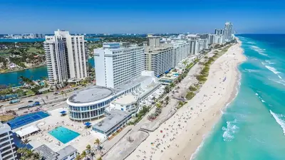 an aerial view of a beach with buildings and the ocean at A dreamed bay view studio at Castle Beach Club in Miami Beach