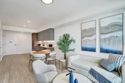 a living room with a couch and a table at 72 Park- Luxury Condo With Private Beach Access in Miami Beach