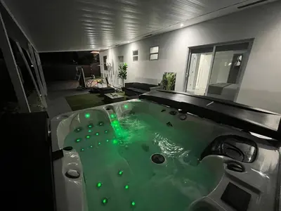 a bathroom with a tub with green water in it at Villa Gabriel Modern, Family Home Just 15 minutes downtown Miami in Miami