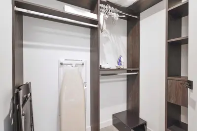 a walk in shower in a bathroom with a glass door at Stylish Studio in Brickell Core in Miami