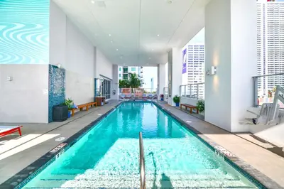 a large swimming pool in a building at Stylish Studio in Brickell Core in Miami