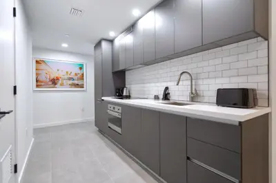 a kitchen with a sink and a microwave at Stylish Studio in Brickell Core in Miami