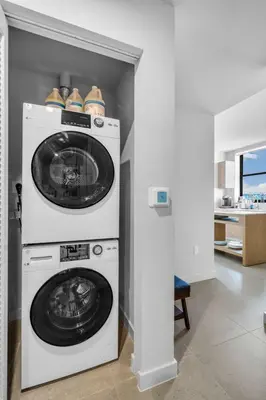 a laundry room with a washer and dryer at Luxury 2 Bedroom Corner Unit Crosby Rooftop Pool in Miami