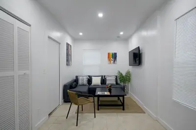 a living room with a couch and a table at Historical Little Havana 2 Bed with Parking in Miami