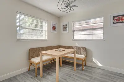 a dining room with a table and two chairs at Walk to Shops and Eats, 3 Mi to Beach! Hollywood Gem in Hollywood