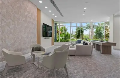 a living room with a couch and a table and chairs at Family Tides At GalleryOne in Fort Lauderdale